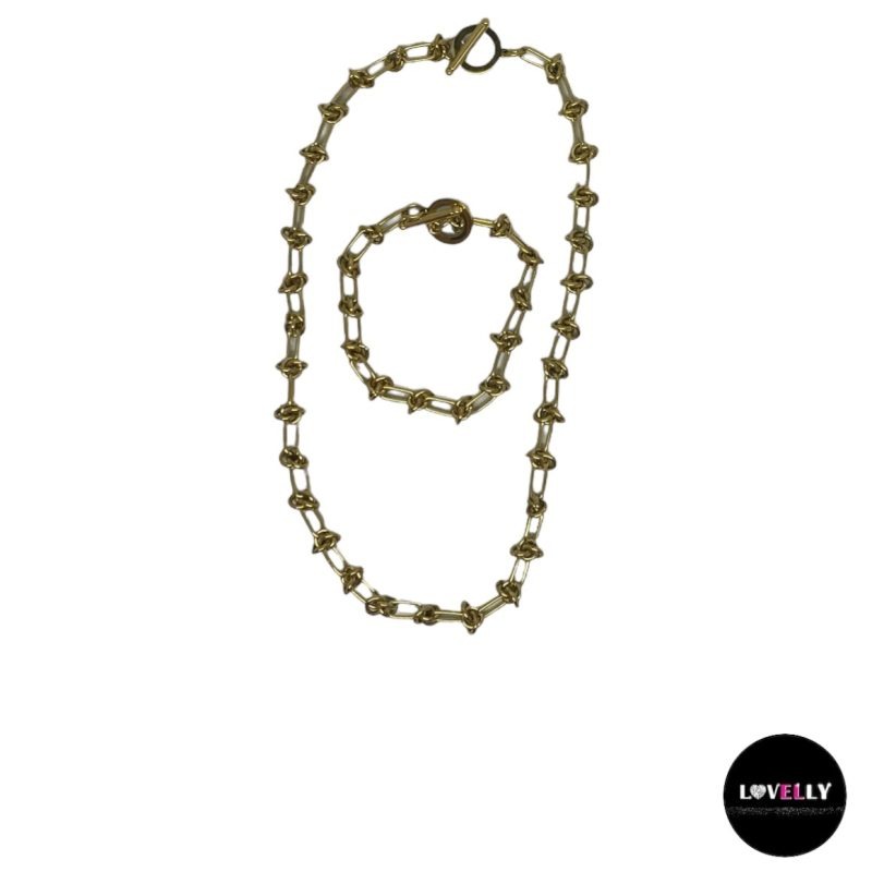 Parure maille ovale et effet nœud avec fermoir en T en acier doré-Lovelly Martinique